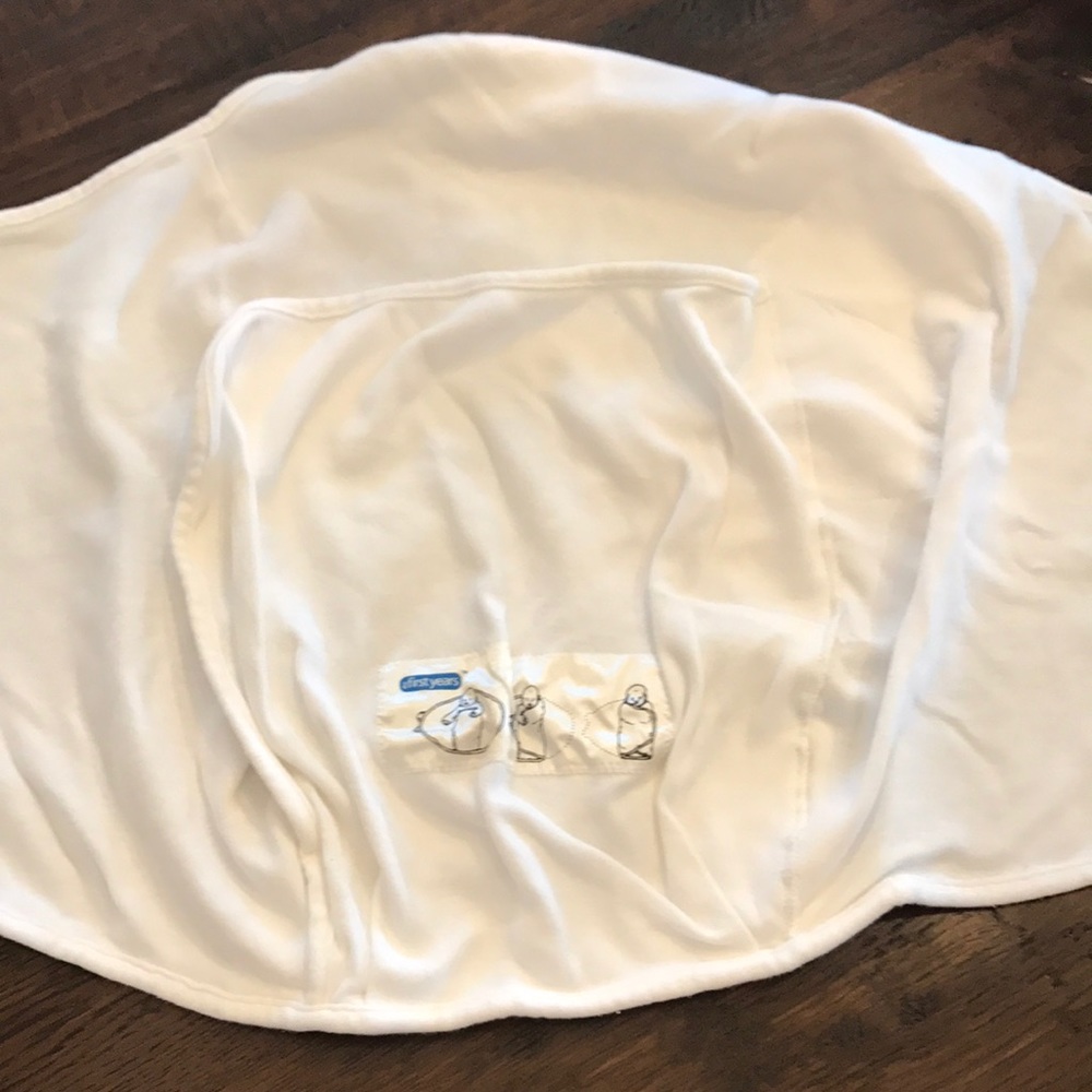 The First Years baby swaddler white